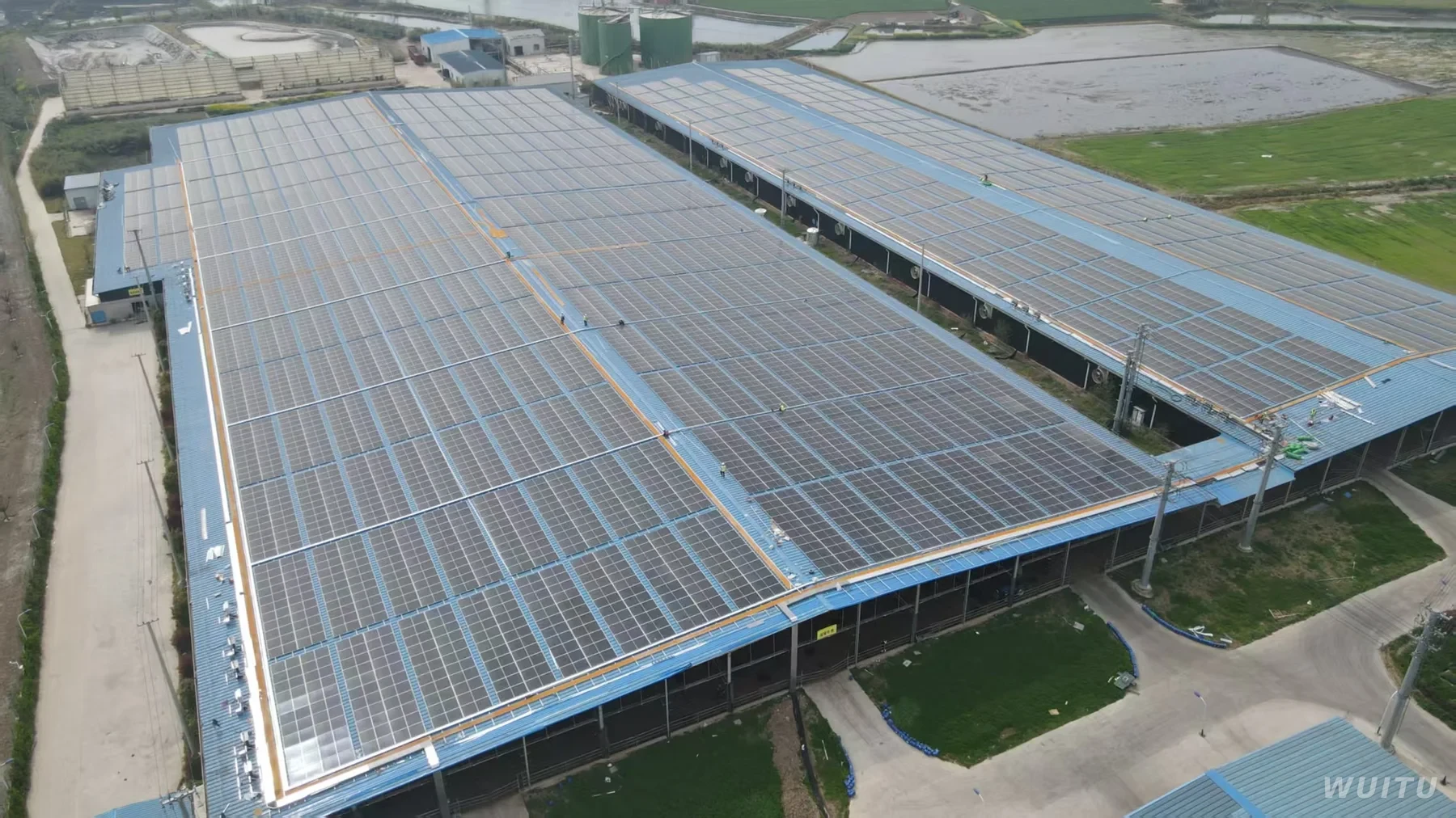 Aerial view of a distributed rooftop solar project on a ranch